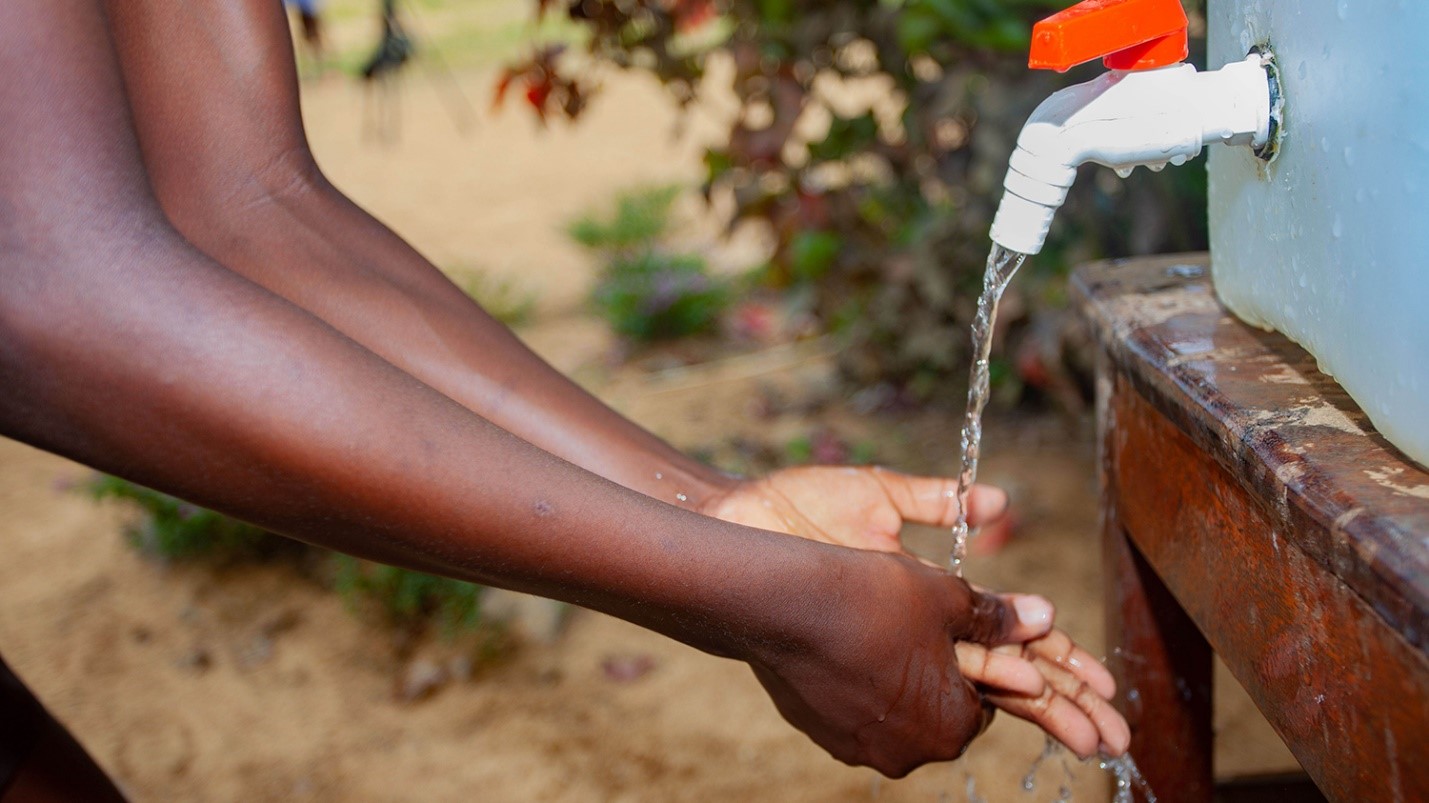 Person washing hands.